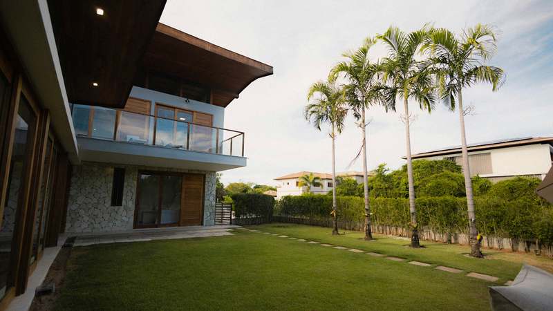 Minimalist modern vacation rental overlooking ocean with clean interior design and natural light